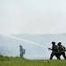 Firefighters operate a hose during a training exercise and controlled burn in 6700 block of Warner Rd. in Pittsfield Township on Thursday, May 9, 2013. Melanie Maxwell I AnnArbor.com